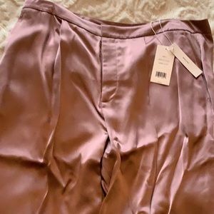 It’s a 100% viscose from brand Vince.  It’s light pink.  It’s brand New.